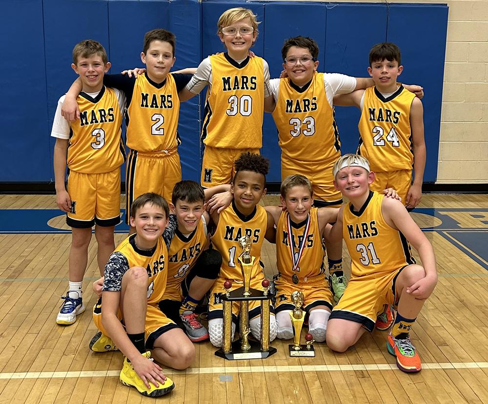 Members of Mars Youth Basketball Association’s Fifth Grade Blue Travel Team, including (back row) Jacob Kleba, Landen Breese, Owen Atwell, Jagger Icuss, Levi Maringer, (front row) Cole Geiger, Luke Miller, Garrett Constant, Jacob Schirato, Jaxon Reddick, pause for a picture after winning the St. Greg’s Thanksgiving Tournament.